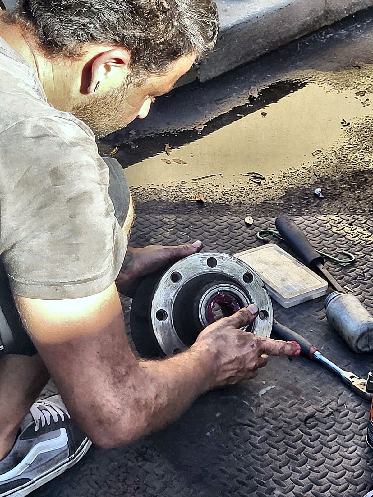 Repacking a trailer hub bearing by hand