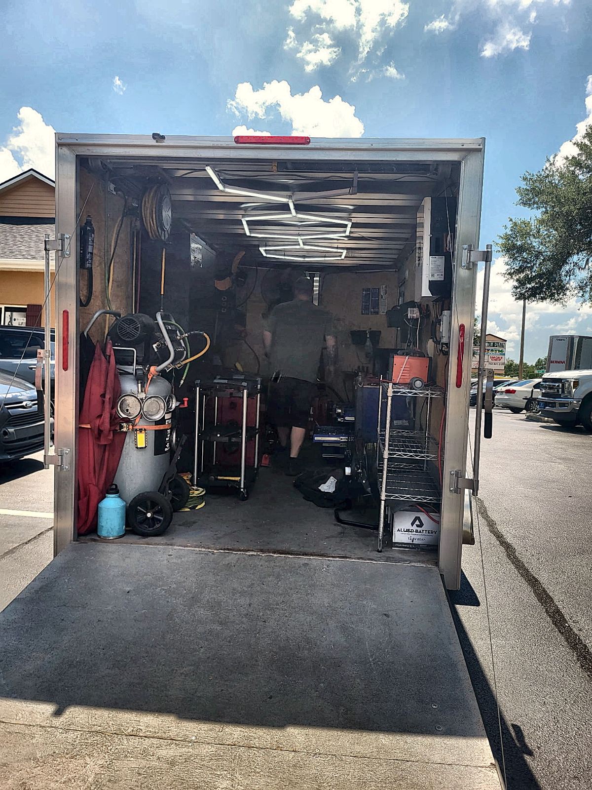 Inside the C&C mobile shop trailer — tire machine, balancer, and tool chests